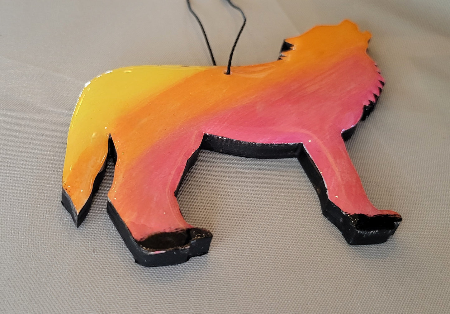 Howling Wolf Sunset Ornament – Handmade with a Fiery Twist