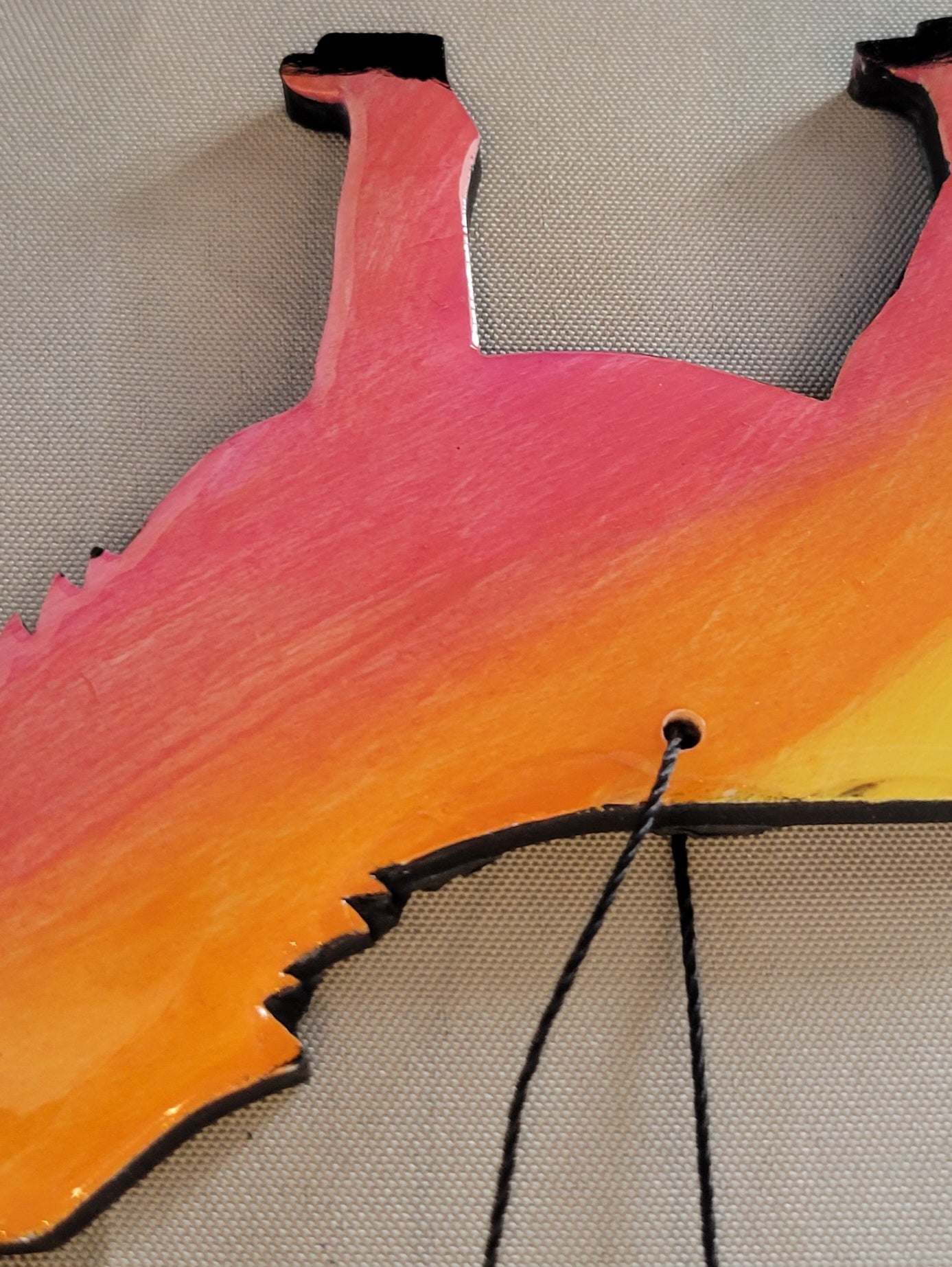 Howling Wolf Sunset Ornament – Handmade with a Fiery Twist