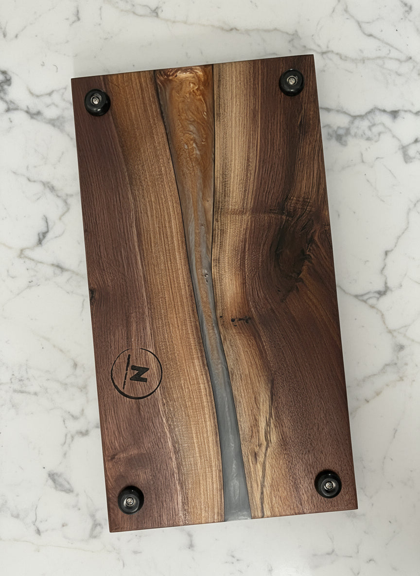 Wooden plaque with metal inlay and visible brand logo on a white background