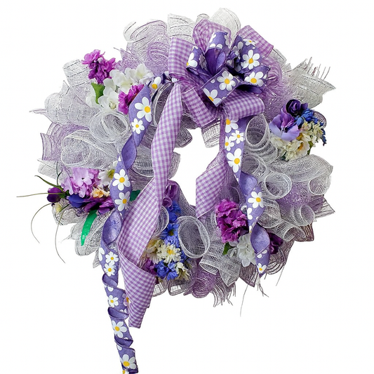 Decorative wreath with purple and white flowers and ribbons on a white background