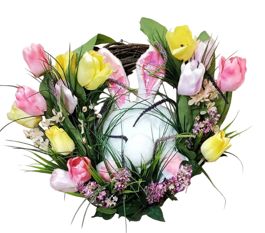 Decorative wreath with Easter eggs and flowers on a white background