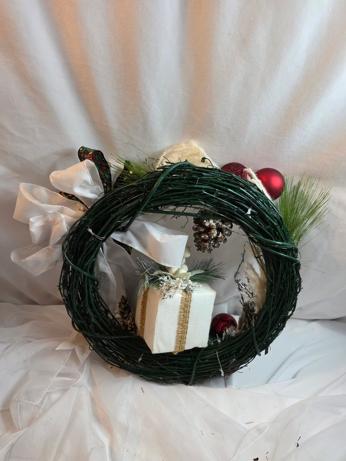 Twilight Evergreen – Green Holiday Wreath with White Bow & Gift Box