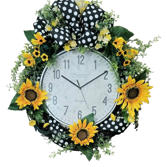 Black grapevine wreath with silver clock center